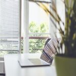 white and black striped chair near window